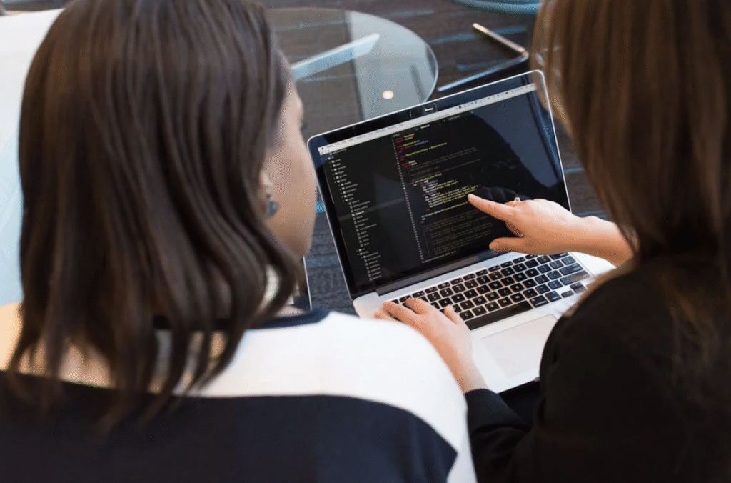 2 Women Looking at a Laptop Screen
